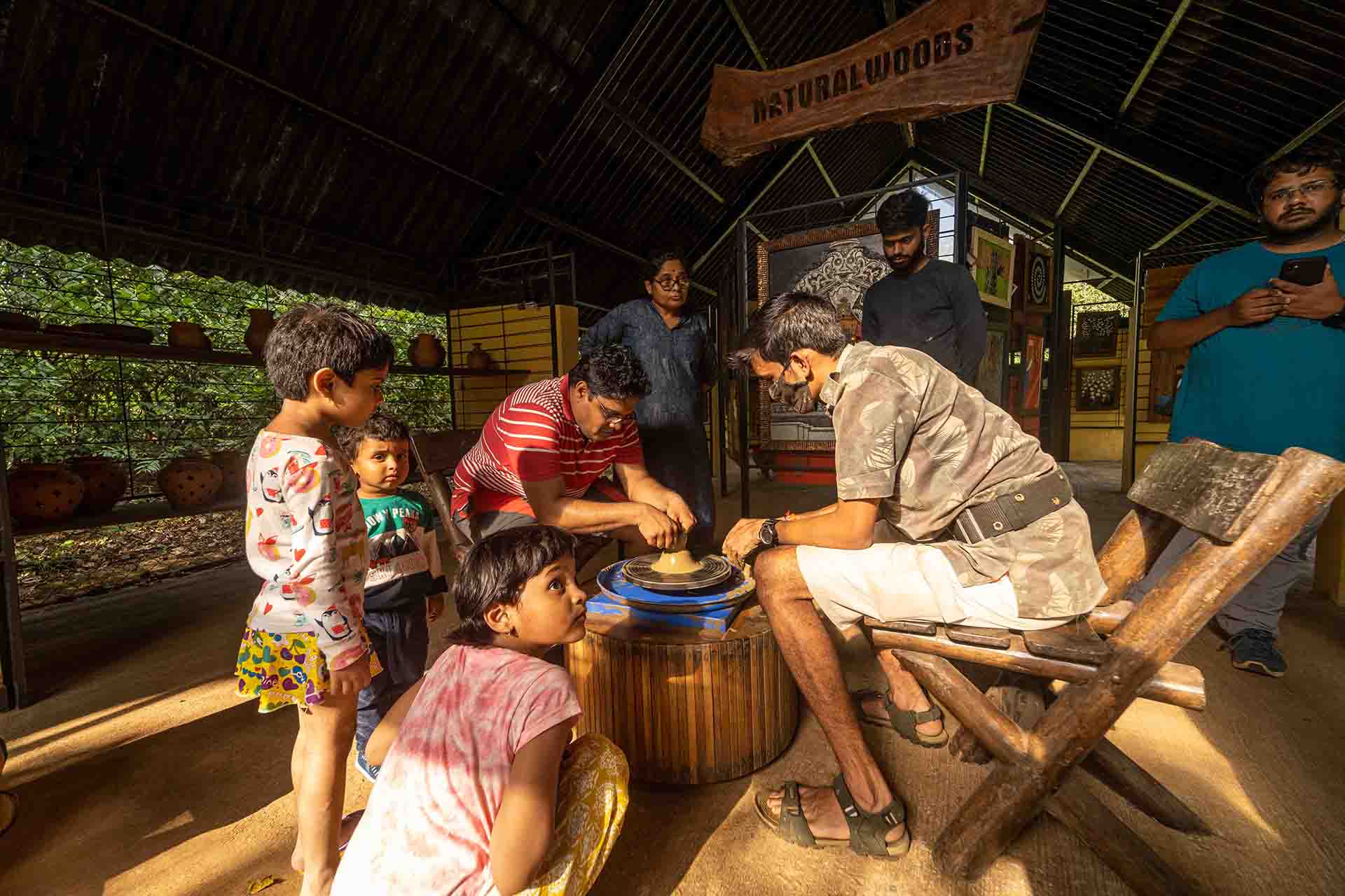 people crafting a pot in the Pottery & Art Studio